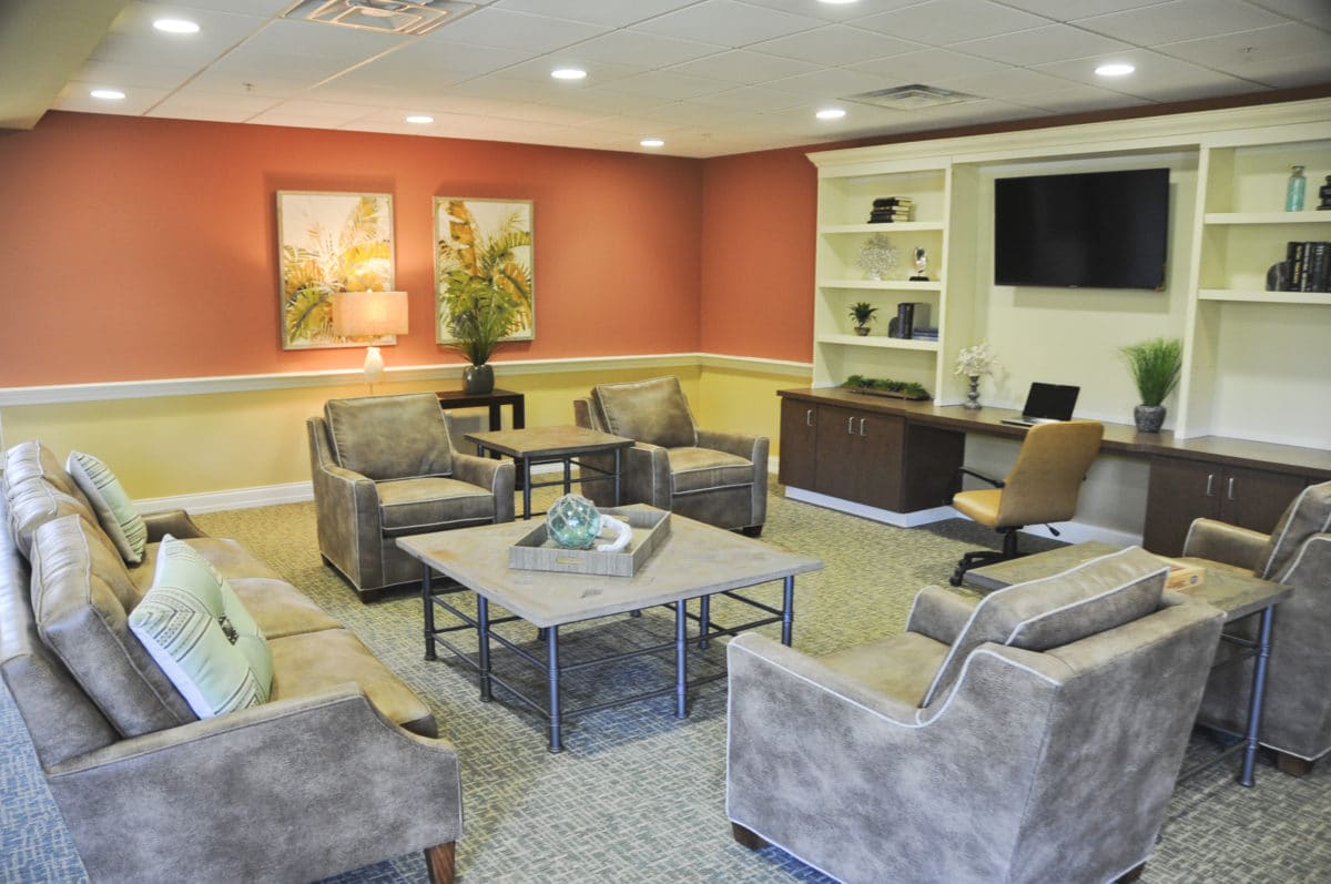 Silver Creek entertainment room with gray couches and TV