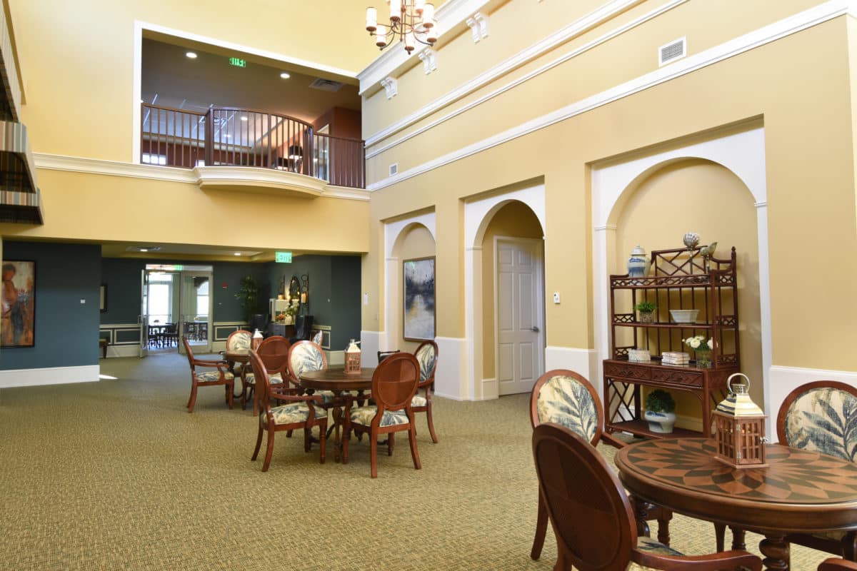 Silver Creek main hallway and upstairs balcony with tables and chairs